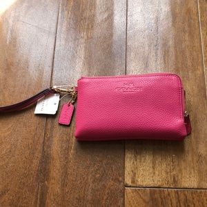 Coach Double zip pink wristlet clutch 6.5” long x 4” tall. Perfect fit for phone